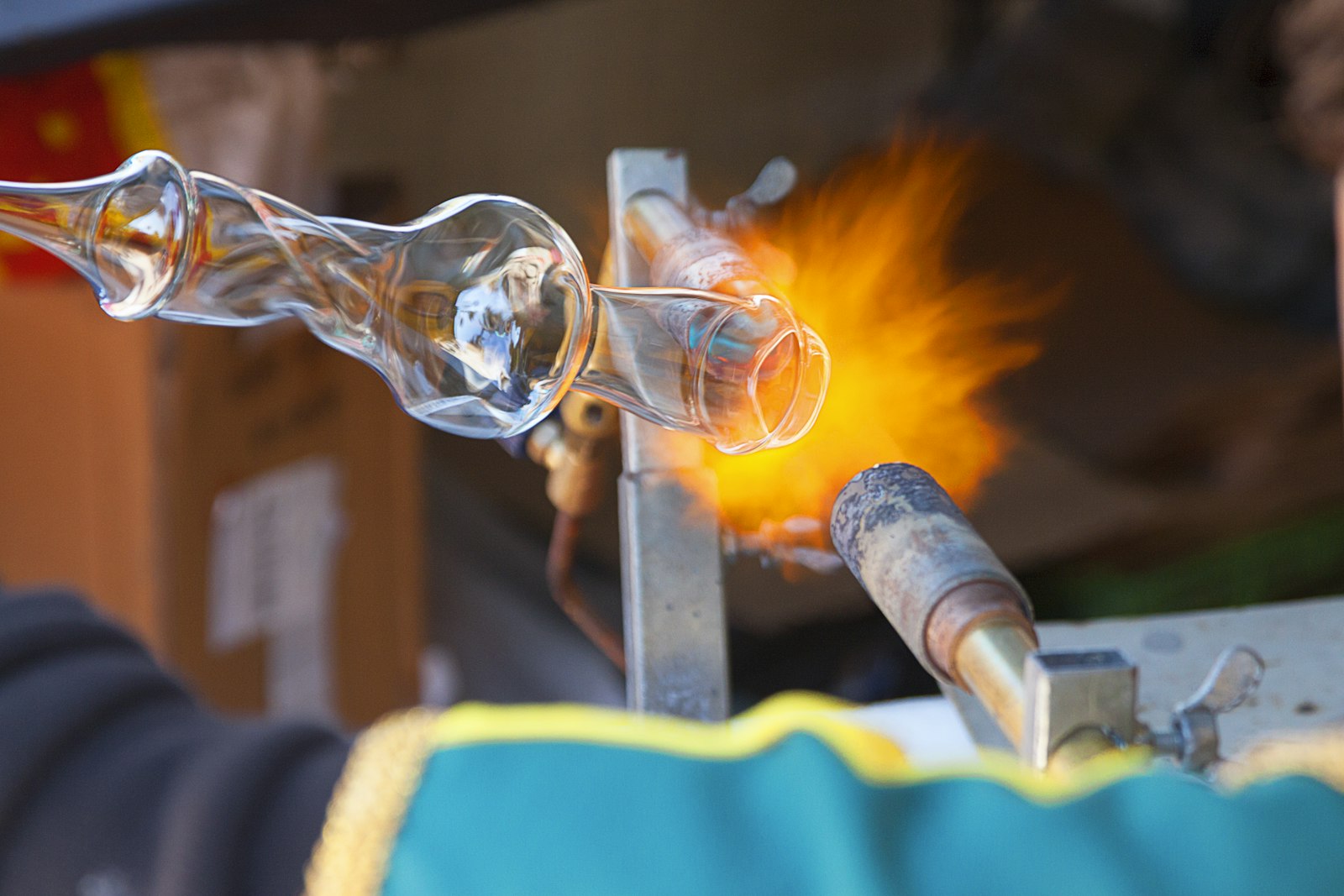Glass being shaped and finished under heat.