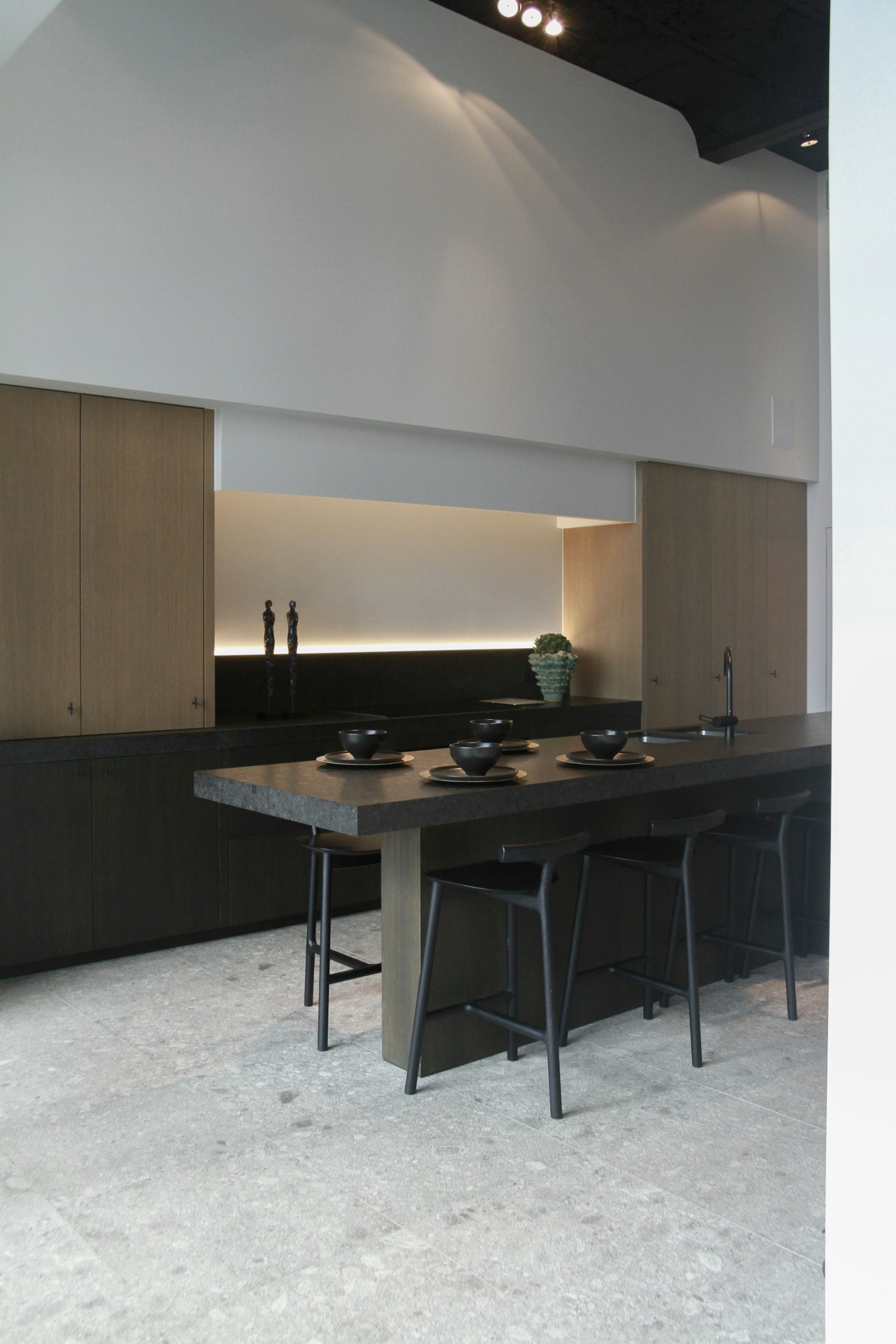 Fitted cabinetry with flush, uniform fronts.