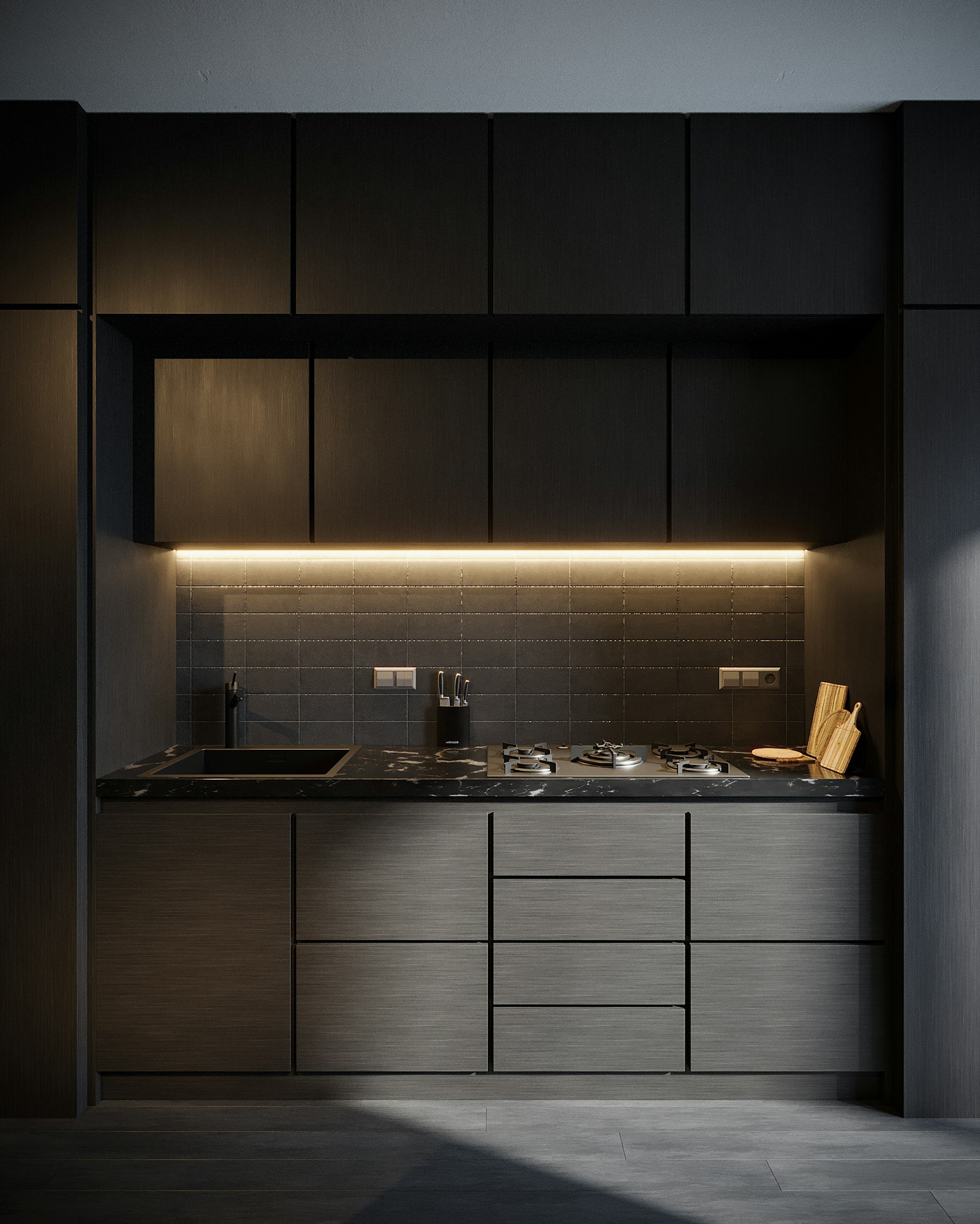 A sink and base units against a full-height panel.