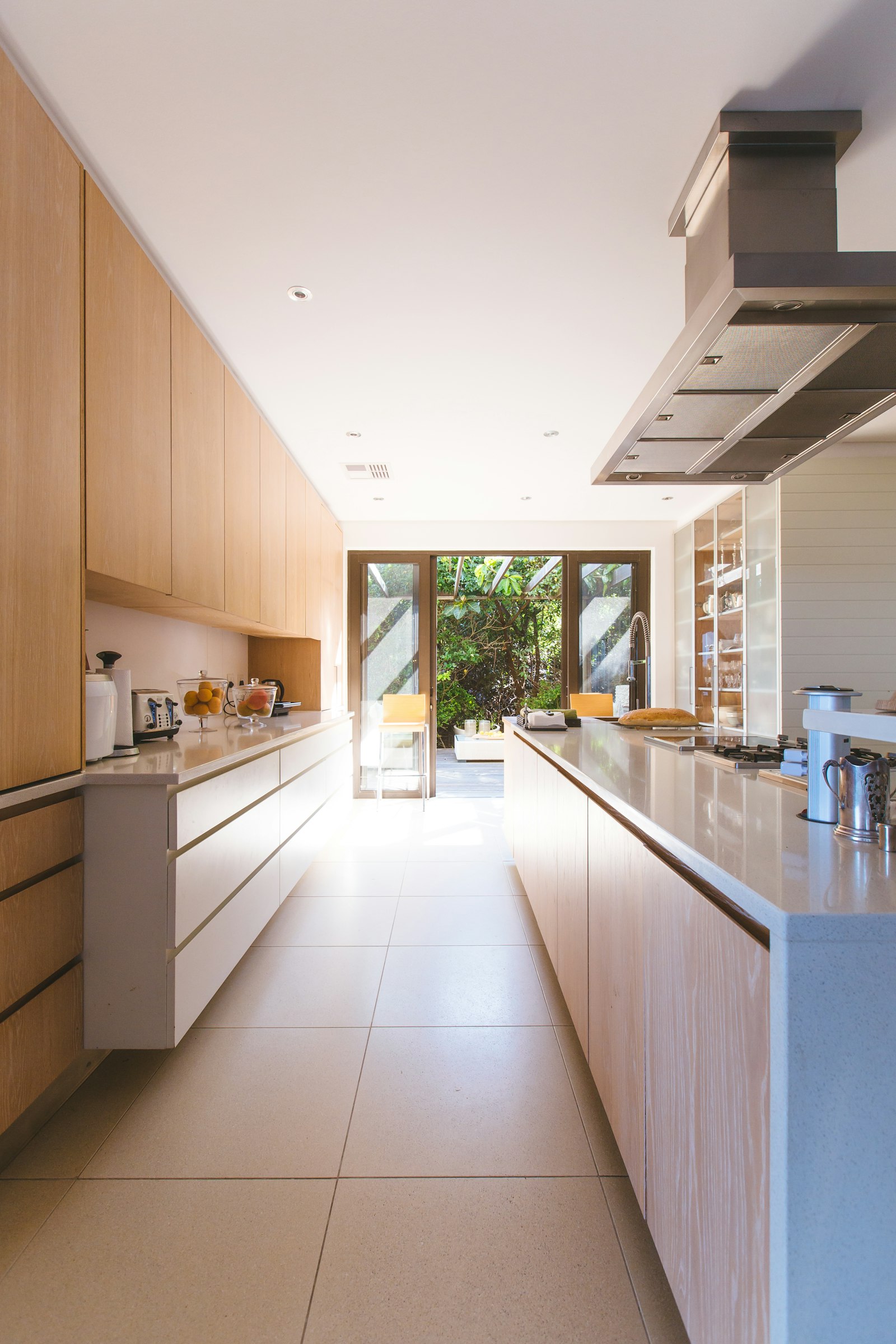 A kitchen island beside a glazed panel door.